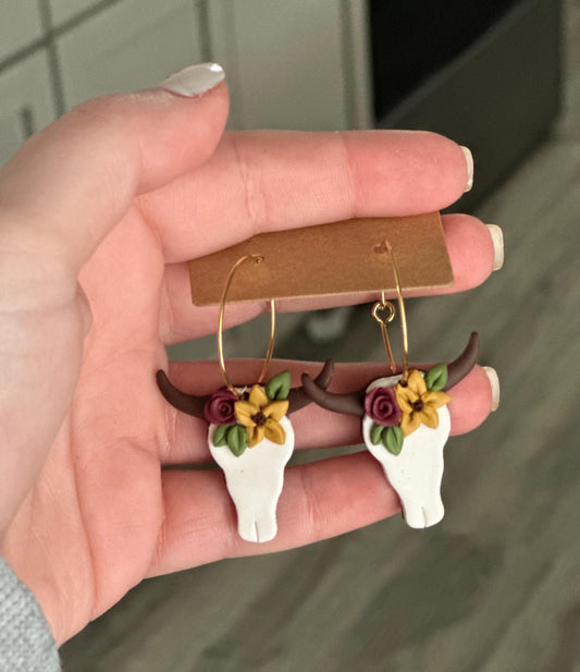 Floral steer dangle